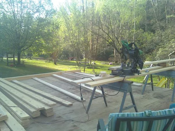 Miter saw and framing lumber on a deck under construction in Sun Valley